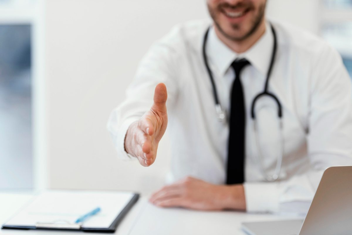 Physician welcoming a patient